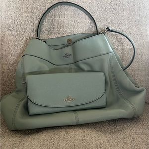 Coach handbag with matching wallet.Light blue brand new never used without tags